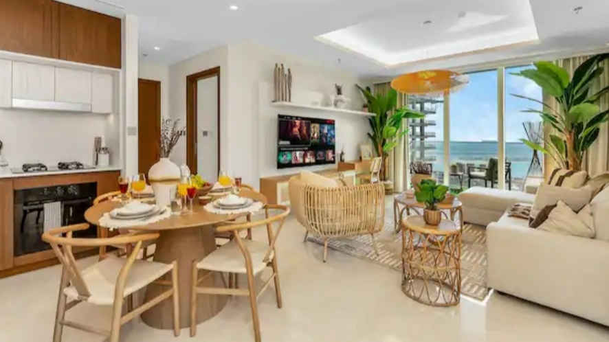 Open-plan living and dining area with sea view